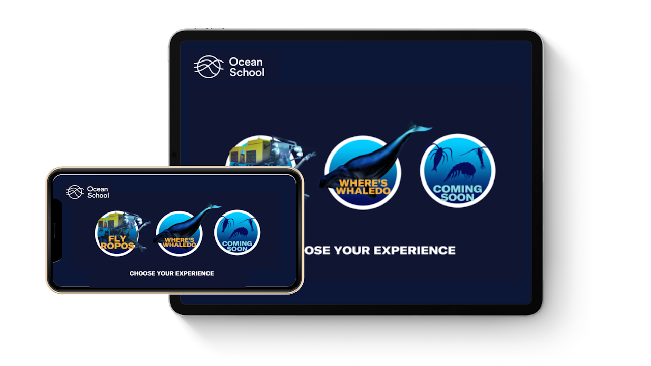 A tablet and mobile phone showing the experience selection page. This page has buttons to the Fly ROPOS and Where’s Whaledo experiences. - click to enlarge A tablet and mobile phone showing the experience selection page. This page has buttons to the Fly ROPOS and Where’s Whaledo experiences.