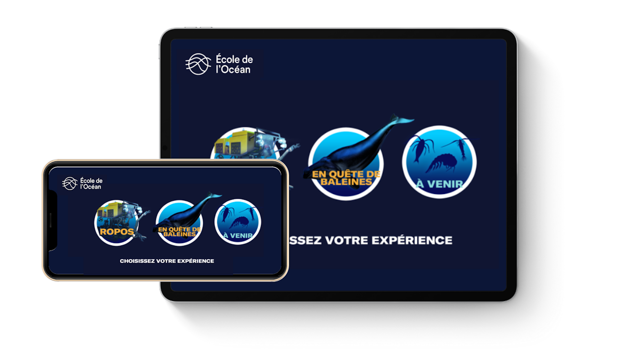 Une tablette et un téléphone mobile montrant la page de sélection des expériences. Cette page contient des boutons pour les expériences Randonnée en ROPOS et En quête de baleines. - click to enlarge Une tablette et un téléphone mobile montrant la page de sélection des expériences. Cette page contient des boutons pour les expériences Randonnée en ROPOS et En quête de baleines.