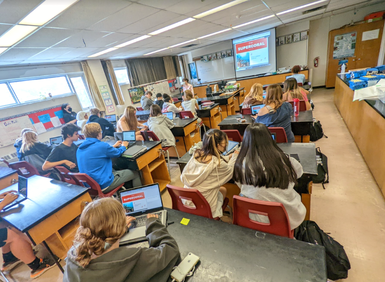 High school students work together on laptops. - click to enlarge High school students work together on laptops.